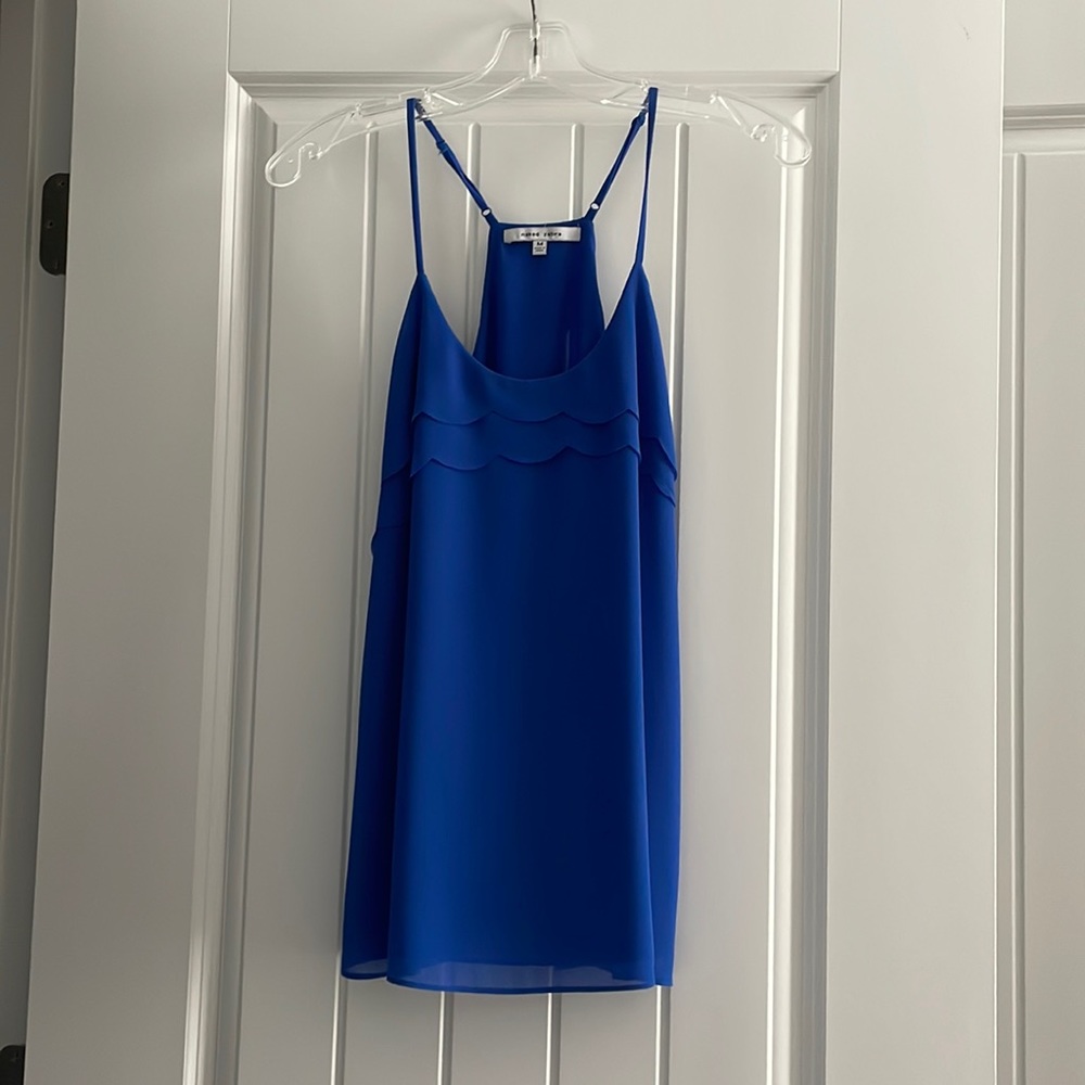 Naked Zebra royal blue razor back top with adjustable straps.